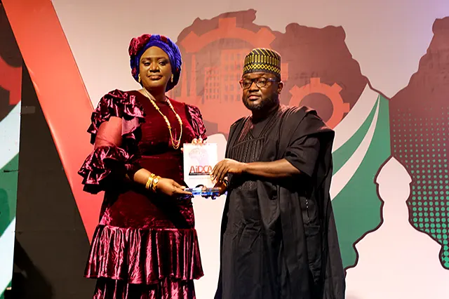 The NOWA National President, Hajiya Nana Aisha Gambo receiving African Industrial and Development Conference Award (AIDCA) of Outstanding Humanitarian of the year